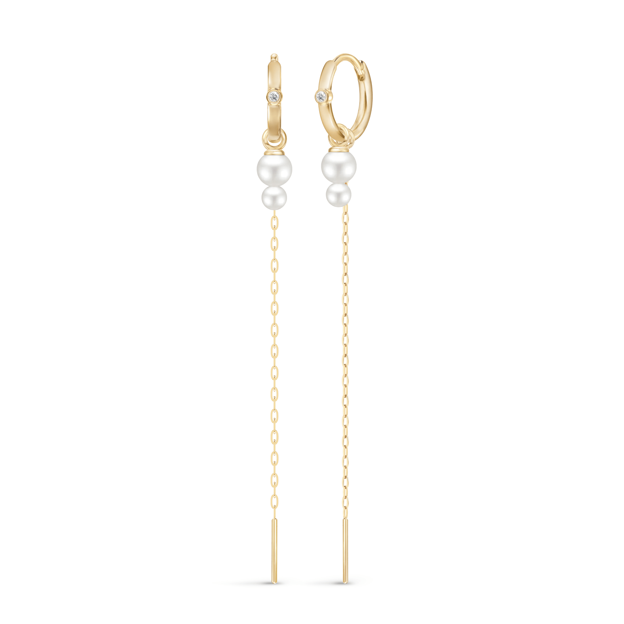 Purity Ear Pendant Look: to matchende øreredsmykker med creoler, diamanter og perle-drop i guld.